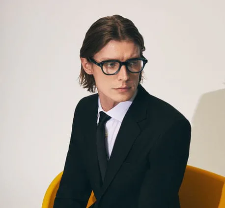 A model wearing Moscot glasses