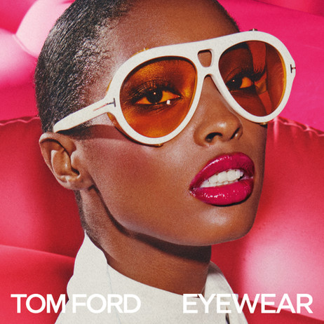 A model wearing white-framed Tom Ford sunglasses