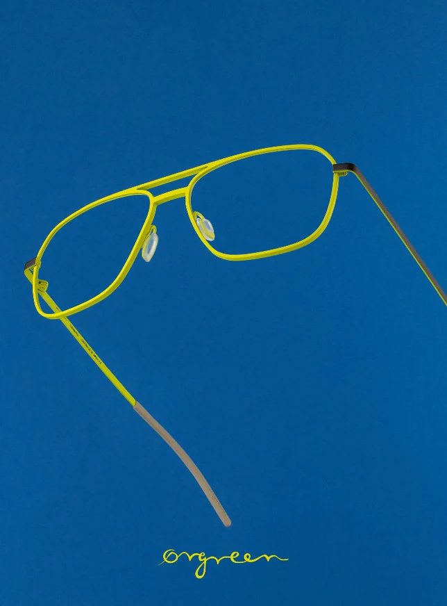 Yellow Orgreen glasses on a blue background