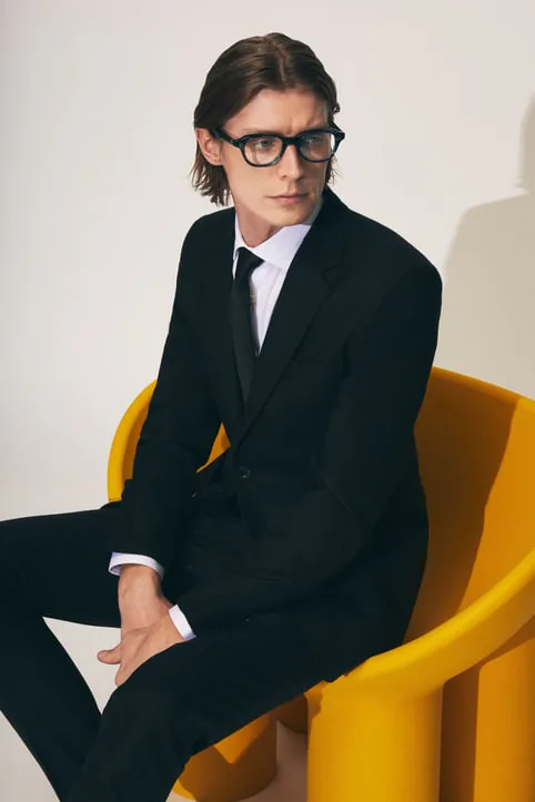 A model wearing Moscot glasses