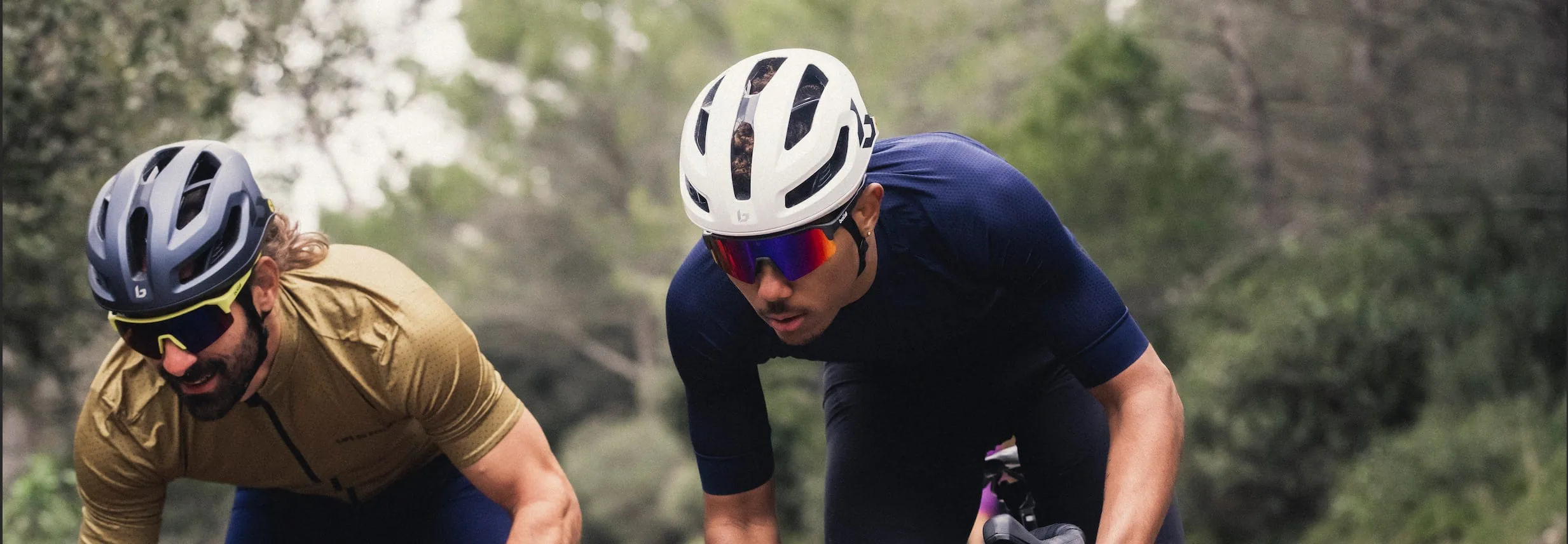 Two cyclists wearing sports sunglasses
