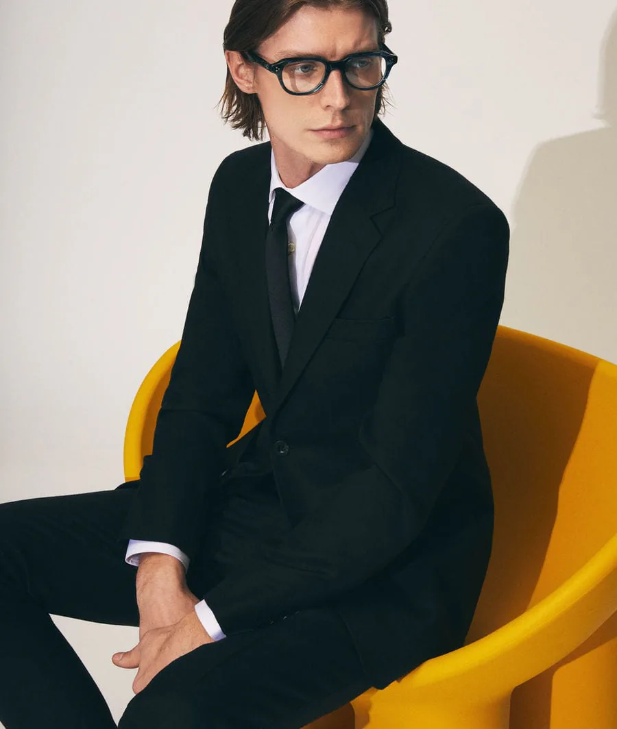 A model wearing Moscot glasses